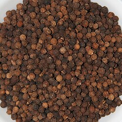 A bowl of dried black peppercorns